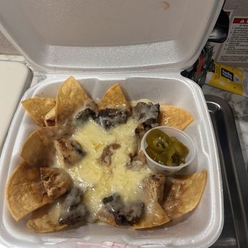 Meches Mexican Restaurant - Chicken and Beef fajita nachos large - Mexican Near Me - Del Valle, Texas Meches Mexican Restaurant - Chicken and Beef fajita nachos large - Mexican Near Me - Del Valle, Texas