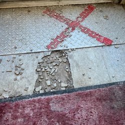 US Post Office - Broken floor tiles. Tripping hazard.