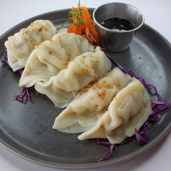 Cluckin' Good - three dumplings on a plate - Thai Near Me - Sacramento, California Cluckin' Good - three dumplings on a plate - Thai Near Me - Sacramento, California