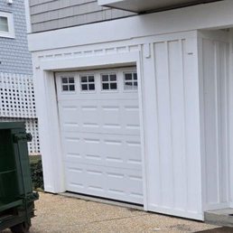 another photo of garage with no damage and dumpster sitting in front of garage. another photo of garage with no damage and dumpster sitting in front of garage.