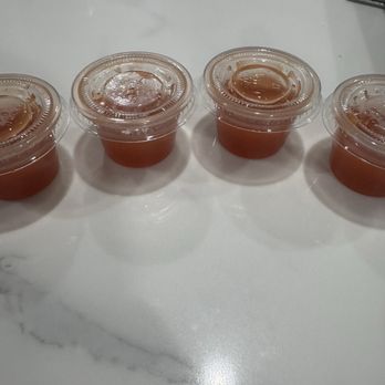 Mama Woods Kitchen - Hot sauce containers - Soul Food Near Me - Moreno Valley, California Mama Woods Kitchen - Hot sauce containers - Soul Food Near Me - Moreno Valley, California