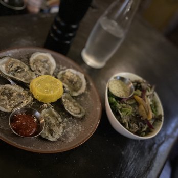 Mint 29 - Oysters with fresh horseradish shaved on top and a house salad - Bars Near Me - Dearborn, Michigan