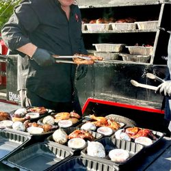 Big Ds BBQ - 'Big D' and his son serving it up!