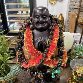 Kapiolani Seafood Restaurant - Buddah adorned with leis and Aloha! - Dim Sum Near Me - Honolulu, Hawaii