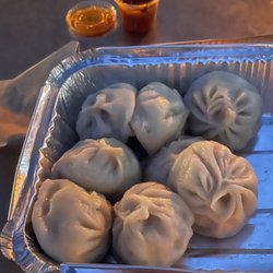 The MoMo House - Need the ORANGE hot sauce; the flavour and spice!  This red one NOT good