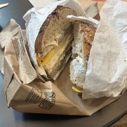 Blueberry French toast bagel with sausage, cheese, and egg with honey vanilla cream cheese. Blueberry French toast bagel with sausage, cheese, and egg with honey vanilla cream cheese.