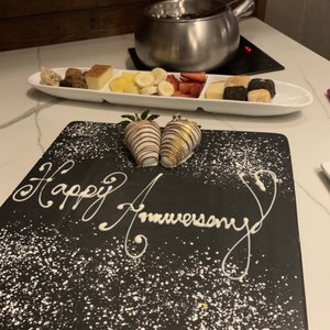 Photo of The Melting Pot - El Paso - El Paso, TX, United States. Dessert and happy Anniversary board!