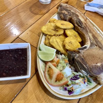 Area 337 - Kan Kan Pork Chop with side salad, tostones and black beans - Puerto Rican Near Me - Lake Charles, Louisiana Area 337 - Kan Kan Pork Chop with side salad, tostones and black beans - Puerto Rican Near Me - Lake Charles, Louisiana
