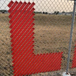 Oak Harbor Intermediate School - Fence art of the snap-in-place ribbon type spelled out "Learn Today Lead Tomorrow".