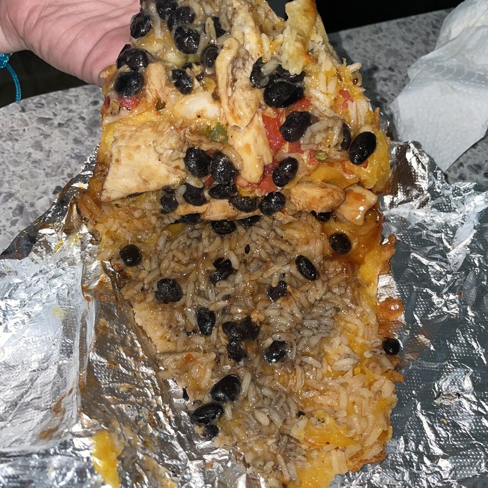 Roburrito's - a hand holding a piece of pizza - Mexican Near Me - York, Pennsylvania Roburrito's - a hand holding a piece of pizza - Mexican Near Me - York, Pennsylvania