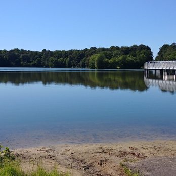 Killens Pond State Park - View of the lake with pedestrian bridge across. - Parks Near Me Killens Pond State Park - View of the lake with pedestrian bridge across. - Parks Near Me