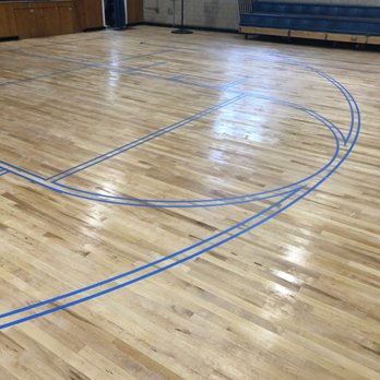 Spagnoli Flooring - Prepping for paint lines on a gym floor - Flooring Near Me - Brooklyn, New York Spagnoli Flooring - Prepping for paint lines on a gym floor - Flooring Near Me - Brooklyn, New York