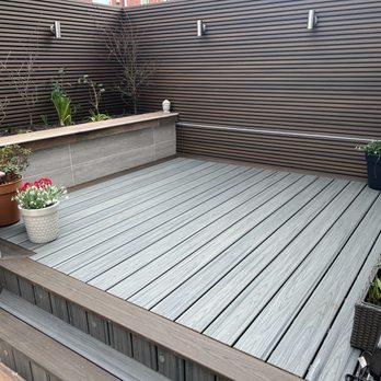 Abel Landscaping - Trex Deck with composite fence screen porcelain cladded walls - General Contractors Near Me - Liverpool, XMS