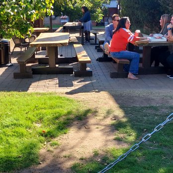 Pizzeria Bianco - The empty picnic tables that people waiting to be seated sat on. Could've served a bunch of folks - Pizza Near Me - Phoenix, Arizona