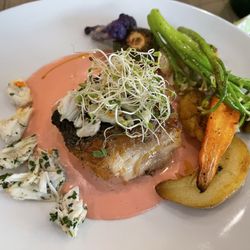 The Henri - Rockfish Imperial: rockfish, topped with lump crab meat, seasonal vegetables & potatoes, with a beet buerre blanc sauce.