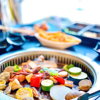 Warehouse Buffet - a pan of food on a table - Buffets Near Me - Foster City, California Warehouse Buffet - a pan of food on a table - Buffets Near Me - Foster City, California