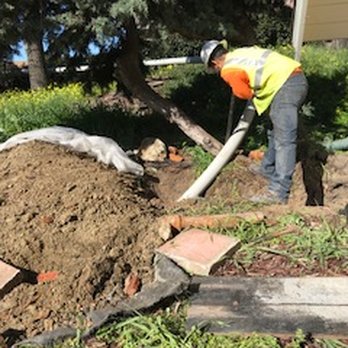 Glosage Engineering - Feeding the new sewer lateral line into the old space to replace the old line. - Septic Services Near Me