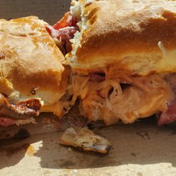 Mancino's Pizza & Grinders - Rueben grinder: corned beef, swiss, a little sauerkraut, thousand island dressing. A random mushroom on the side (?)