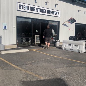 Sterling Street Brewery - Entrance next to a mart in a plaza. - Breweries Near Me - Clinton, Massachusetts