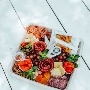 Signor Vineyards - Indulge in charcuterie bliss with our portable boxes at Signor Vineyards! Experience the same delightful ingredients on the great lawn. - Wine Tasting Room Near Me - Fredericksburg, Texas