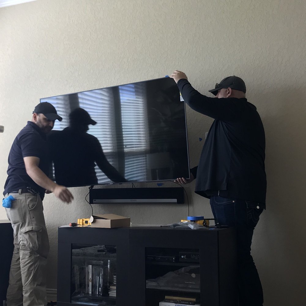 Bjorn's Audio Video - Guys working hard! Love my new tv and surround sound. - Electronics Near Me - San Antonio, Texas Bjorn's Audio Video - Guys working hard! Love my new tv and surround sound. - Electronics Near Me - San Antonio, Texas