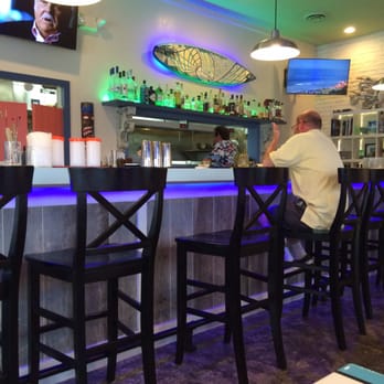 Surf House - The bar. Check out the surfboard mirror. - New American Near Me - Frederick, Maryland