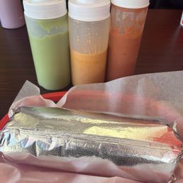 Super burrito and 3 different sauces from mild to hot Super burrito and 3 different sauces from mild to hot