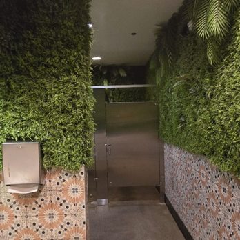 Kalaveras - Weird bathroom with plastic greenery - New Mexican Cuisine Near Me - Long Beach, California
