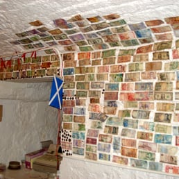 Currency from different countries over the walls