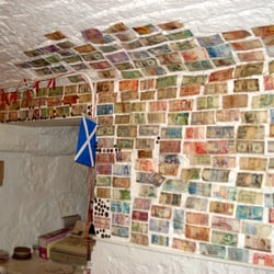 Darnley Coffee House - Currency from different countries over the walls