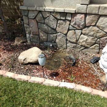Aran Arbor and Landscape Care - Water started to pool in the flowerbed - Landscaping Near Me