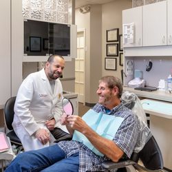 Davinci Dentistry & Implants - Dr. Raed with a happy patient