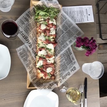 Sakonnet Vineyard - Prescuito goat cheese and arugula flatbread! - Wineries Near Me - Little Compton, Rhode Island