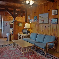 Open living, dining and kitchen area in Oceanside cottage