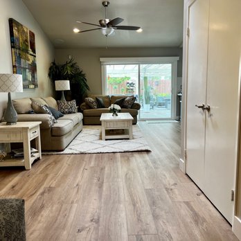 Unique Flooring - a living room with a ceiling fan - Flooring Near Me - Oceanside, California