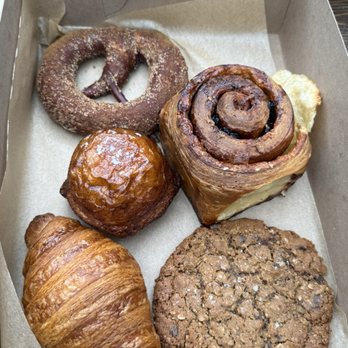Sea Wolf Bakers - An array of goodies! Cinnamon sugar pretzel, cinnamon roll sans frosting, kouign-aman, croissant, and their chocolate chip cookie. - Bakeries Near Me - Seattle, Washington Sea Wolf Bakers - An array of goodies! Cinnamon sugar pretzel, cinnamon roll sans frosting, kouign-aman, croissant, and their chocolate chip cookie. - Bakeries Near Me - Seattle, Washington