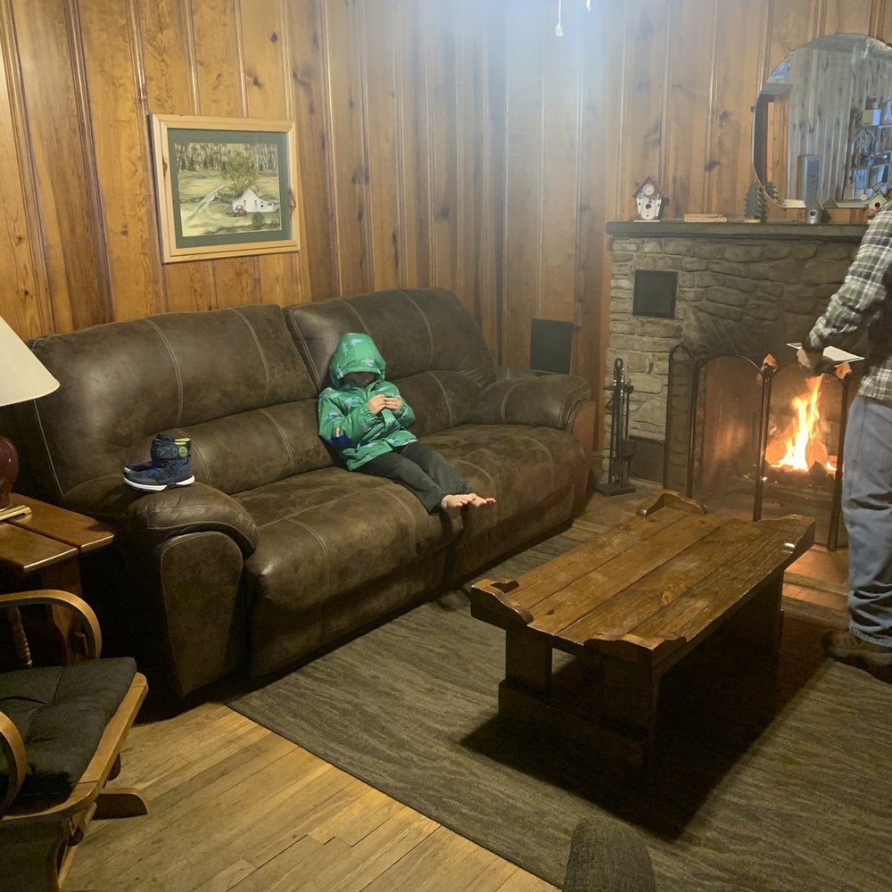 Cabins At Cloudcroft - My son enjoying the warmth from the fire. - Vacation Rentals Near Me - Cloudcroft, New Mexico Cabins At Cloudcroft - My son enjoying the warmth from the fire. - Vacation Rentals Near Me - Cloudcroft, New Mexico