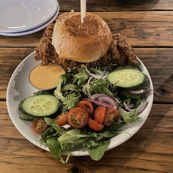 Pacific Coast Spirits - Hot chicken sandwich - spicy with a great side salad! - New American Near Me - Oceanside, California