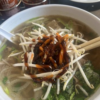 Miss Saigon - Round eye pho with chili oil, sriracha and hoisin sauce - Vietnamese Near Me - Centreville, Virginia Miss Saigon - Round eye pho with chili oil, sriracha and hoisin sauce - Vietnamese Near Me - Centreville, Virginia