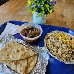 Khloe's Caribbean Spice - Left-Roti and Curry Goat Right- Cook up chicken rice and chow mein so delicious