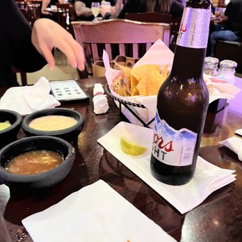 Costa Messa Restaurant - a beer and chips on a table - Mexican Near Me - McAllen, Texas Costa Messa Restaurant - a beer and chips on a table - Mexican Near Me - McAllen, Texas