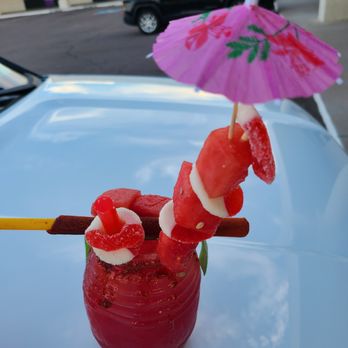 Naughty Tacos - a bloody drink with a pink umbrella - Food Trucks Near Me - Phoenix, Arizona