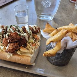 Oyster po boy with fries. Oyster po boy with fries.