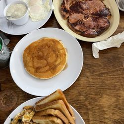 Cornerstone Cafe - Ham Steak and Egg (over medium) Plate with grits and a short stack.