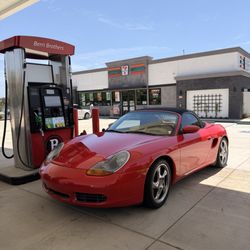 Berri Brothers - Gas Pump with 7-11 store in background