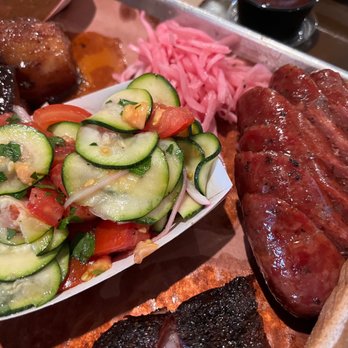 Interstellar BBQ - Tomato and zucchini (left) and beef kielbasa (right) - Barbeque Near Me - Austin, Texas