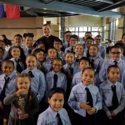 Holy Name Catholic School - Our wonderful choir with San Antonio's Archbishop!