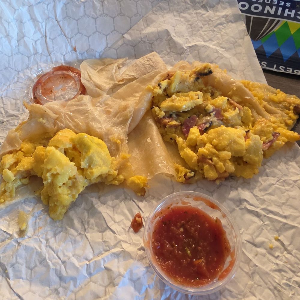 MoJoe's - Bacon breakfast burrito cut in half. So much tortilla, zero bacon on half the burrito. Other half with a dissappointing few small pieces. - Coffee & Tea Near Me - Roseville, California MoJoe's - Bacon breakfast burrito cut in half. So much tortilla, zero bacon on half the burrito. Other half with a dissappointing few small pieces. - Coffee & Tea Near Me - Roseville, California