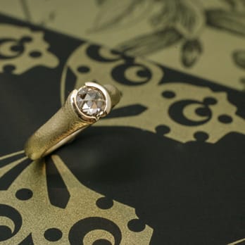 Cronin Jewelers - A rose cut light brown diamond set with a partial bezel and a matte hammered finish. Custom made in house! - Jewelry Near Me - Boulder, Colorado Cronin Jewelers - A rose cut light brown diamond set with a partial bezel and a matte hammered finish. Custom made in house! - Jewelry Near Me - Boulder, Colorado