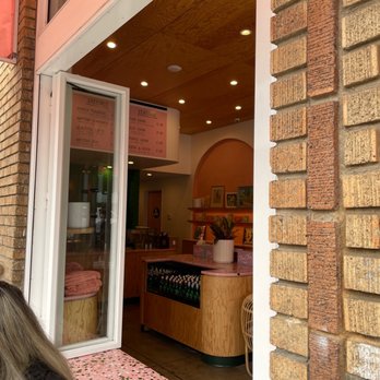 Cha Cha Matcha - a woman sitting outside of a coffee shop - Coffee & Tea Near Me - Venice, California Cha Cha Matcha - a woman sitting outside of a coffee shop - Coffee & Tea Near Me - Venice, California